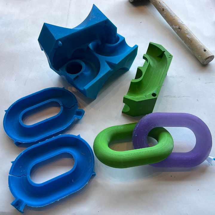<i>Untitled</i>. An image of a mold and cast set up to make indefinitely long resin chains.
