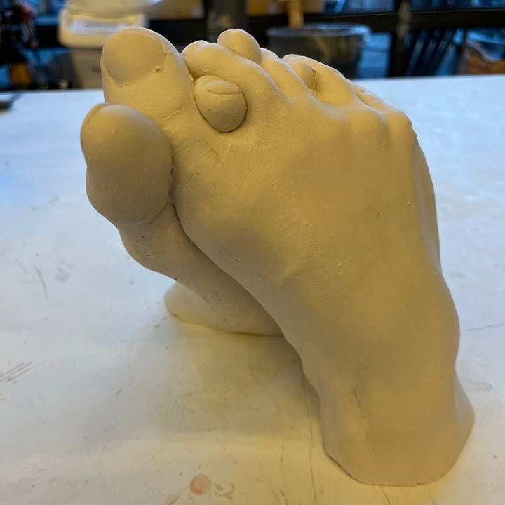 <i>Untitled</i>. A cast of my feet with interlocking toes.