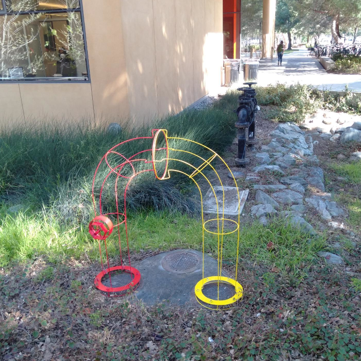 <i>Union</i>. Welded steel rod and sheetmetal forming a U shaped fire hydrant.